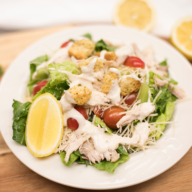 A chicken Caesar salad.